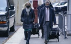 Attorneys Laura Menninger, left, and Jeffrey Pagliuca arrive to court in New York, Monday, Nov. 29, 2021. Two years after Jeffrey Epstein’s suicide 