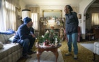 Pete Magnuson chatted with Marshie Allen in her home while making her Meals on Wheels delivery on Thursday in Minneapolis.
