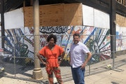Project Manager Taylor Smrikárova, left, and Executive Director Chris Romano of Redesign, which has acquired the riot-damaged Coliseum building on 27
