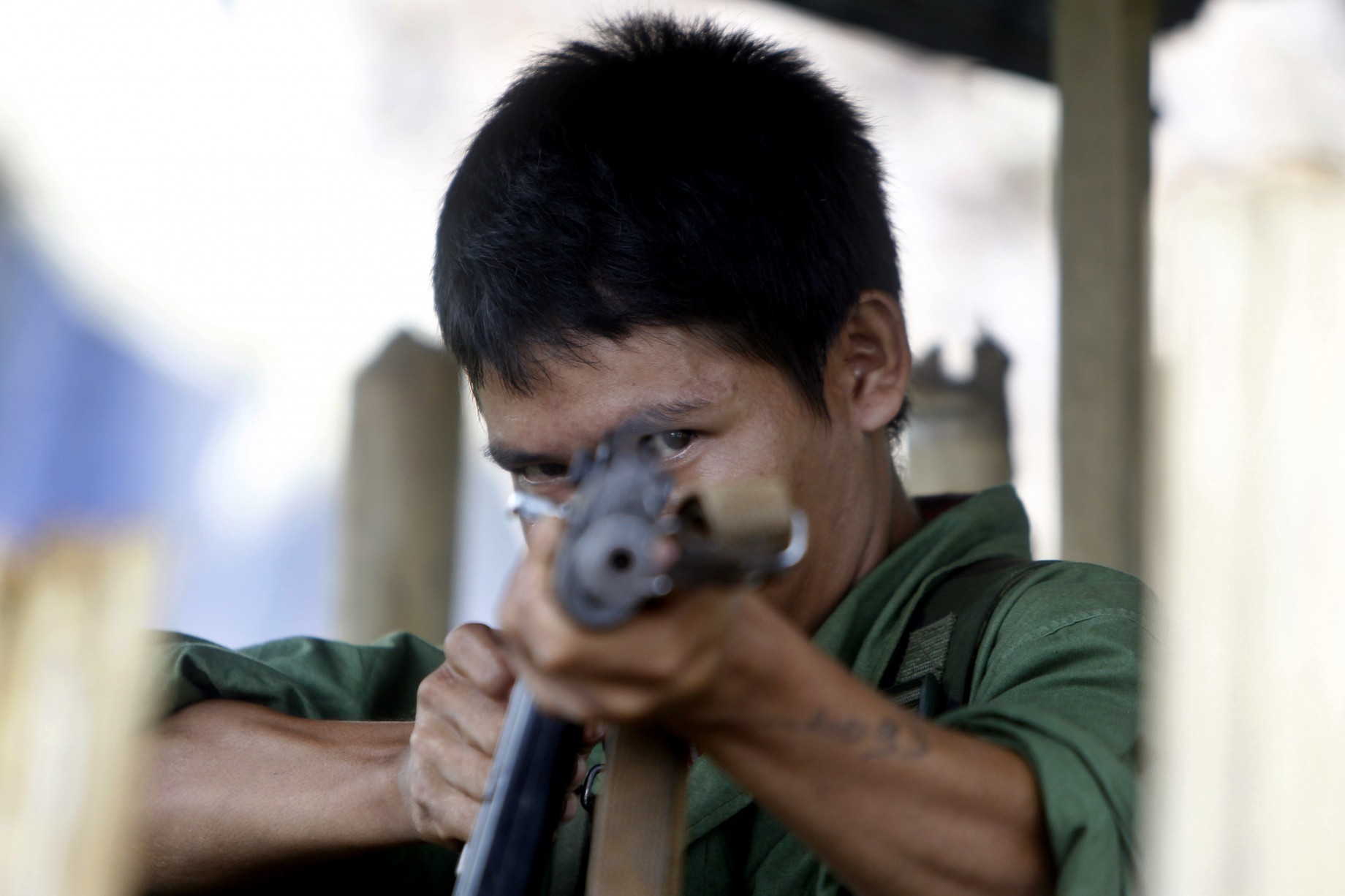 An archive photo of a KIA soldier aiming his gun (EPA)