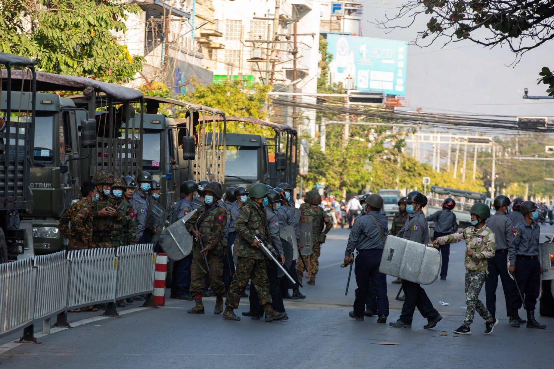 Soldiers and police during a crackdown on anti-coup protesters in Mandalay on February 15 (Myanmar Now)