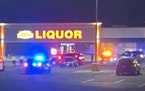 The scene outside Merwin Liquor in Mounds View where police shot and killed a man allegedly involved in a carjacking.