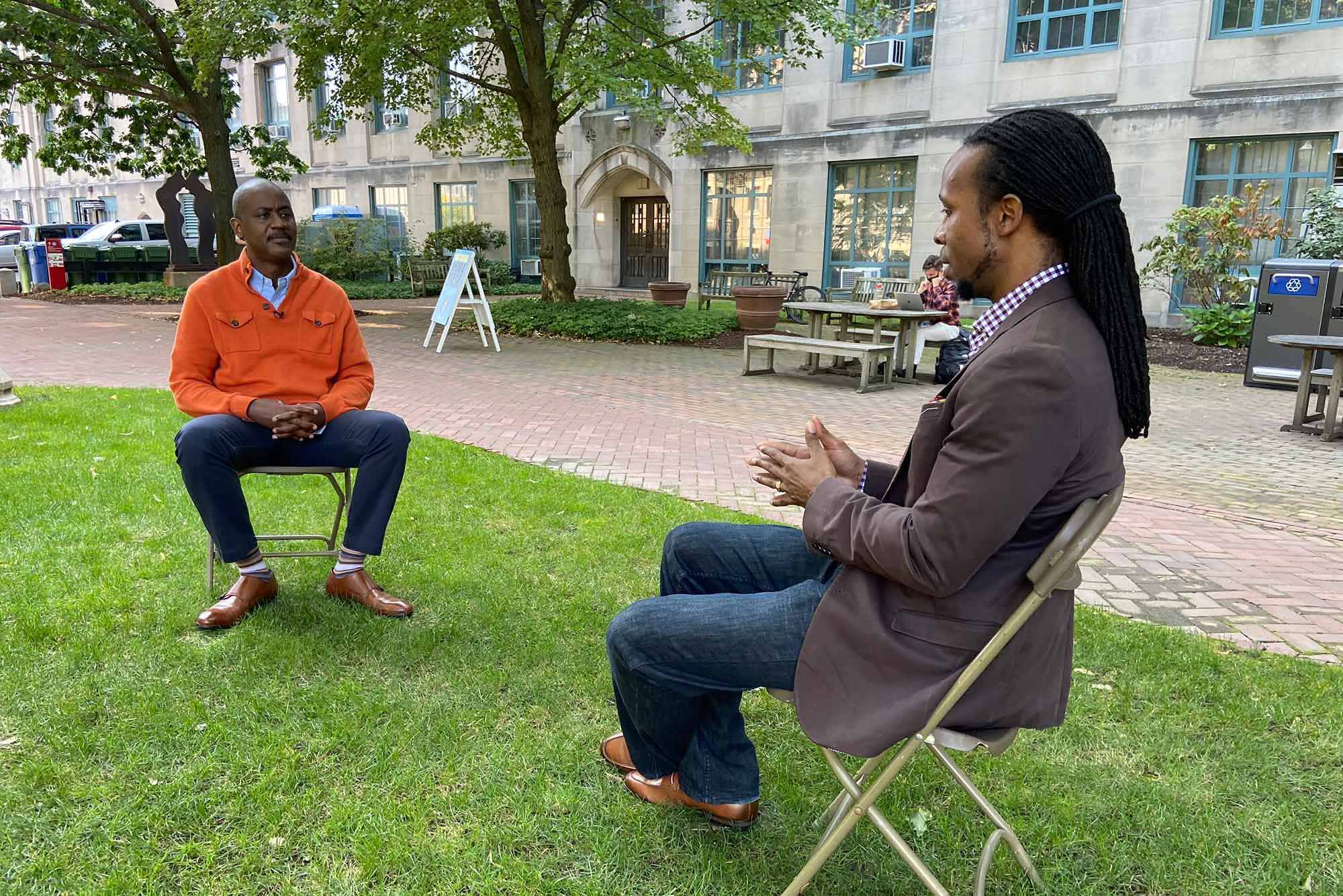 Otis Rolley III, Senior Vice President, U.S. Equity and Economic Opportunity Initiative at The Rockefeller Foundation, and Ibram X. Kendi, Director and Founder of the Boston University Center for Antiracist Research, in a discussion outdoors at Boston University. Photo courtesy of The Rockefeller Foundation