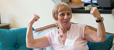 Older woman making muscles with her arms
