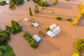 Flooded streets and houses in Maryborough, Australia. [Queensland Fire and Emergency Services/Handoud via AP]