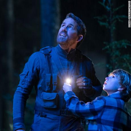 The Adam Project (L to R) Ryan Reynolds as Big Adam and Walker Scobell as Young Adam. Cr. Doane Gregory/Netflix © 2022