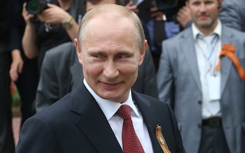 Russian President Vladimir Putin attends a military parade on May 9, 2014 in Sevastopol, Russia