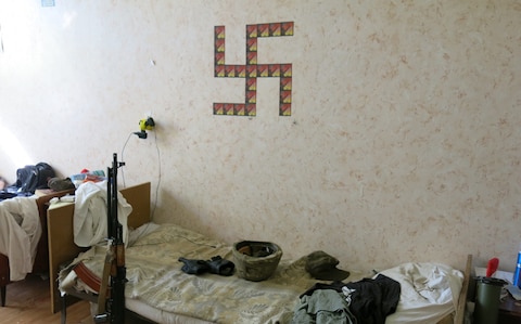 A swastika adorns the wall of an Azov Battalion bunkhouse in Mariupol in 2014