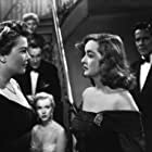 Bette Davis, Marilyn Monroe, Anne Baxter, George Sanders, Celeste Holm, Hugh Marlowe, and Gary Merrill in All About Eve (1950)