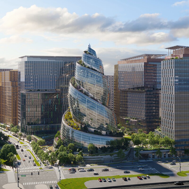 An image of the helix building at Amazon's HQ2 surrounding by other office buildings and greenery in the area.