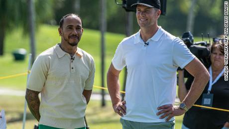 Mercedes&#39; British driver Lewis Hamilton (L) and and NFL quarterback Tom Brady attend the Big Pilot Charity Challenge at the Miami Beach Golf Club, in Miami Beach, Florida on May 4, 2022. (Photo by Giorgio VIERA / AFP) (Photo by GIORGIO VIERA/AFP via Getty Images)