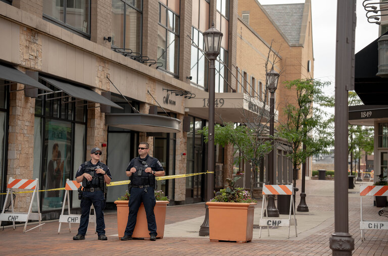 A section of downtown Highland Park, Ill., where six people were killed and dozens injured at a parade remained sealed off as a crime scene on Tuesday. 