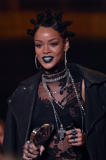 Rihanna in 2014 wearing a slicked updo featuring Bantu knots.