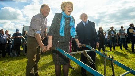 President Michael D Higgins and his wife Sabina with ploughman JJ Delane from East Cork. Photo: Mark Condren