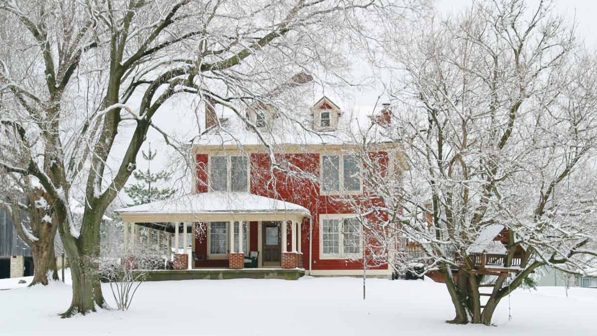 A red house in the snow.