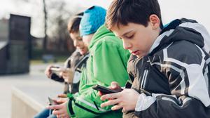 Ninety-five percent of children own a smart device. Stock Image