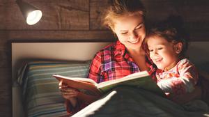 Something calming, such as reading a story, is part of the 'gold standard' bedtime routine for a child. Photo: Picture posed