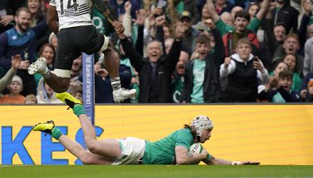 Ireland&rsquo;s Mack Hansen dives over for a try in the 35-17 win over Fiji (Niall Carson/PA Images).