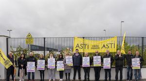 Niall Duddy (centre) supported by represnetatives of the Association of Secondary Teacher' Ireland (ASTI) protesting outside Presentation College, Athenry, Co Galway over school's refusal to allow him attend meetings of the Teaching Council