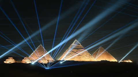GIZA, EGYPT - DECEMBER 03: Light show on the Giza Pyramids during the Dior Fall 2023 Menswear show on December 03, 2022 in Giza, Egypt. (Photo by Stephane Cardinale - Corbis/Corbis via Getty Images)