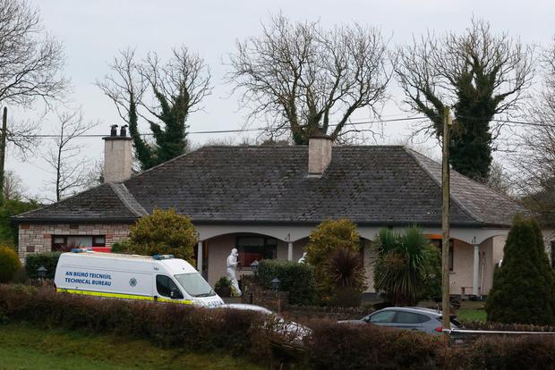 Forensic officers at a house in Castleblayney, Co Monaghan, where the body of a man was discovered. Photo: Liam McBurney