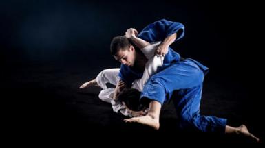 Two jiu-jitsu fighters in hold