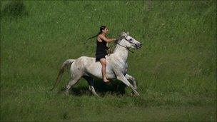 A woman riding a horse at Fort Berthold Reservation