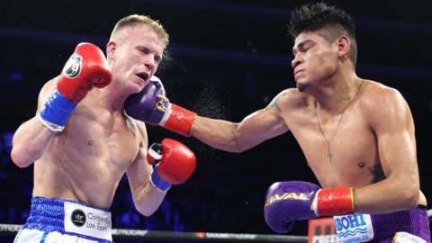 Liam Wilson (left) and Emanuel Navarrete exchange punches during their vacant WBO super-featherweight championship fight at Desert Diamond Arena in Glendale, Arizona