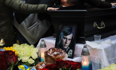 Hundreds of mourners pay their respects to a Ukrainian soldier killed in the battle for Bakhmut in the country’s east