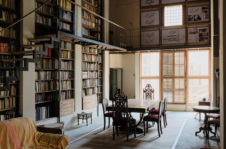 In the library of Bayt Yakan, a building renovated over the past 12 years by Alaa el-Habashi and his wife, Ola Said, a restored 19th-century ceiling that collapsed in 2005. Architectural drawings of the space surround the upper window, and many of the furnishings come from the couple’s relatives.
