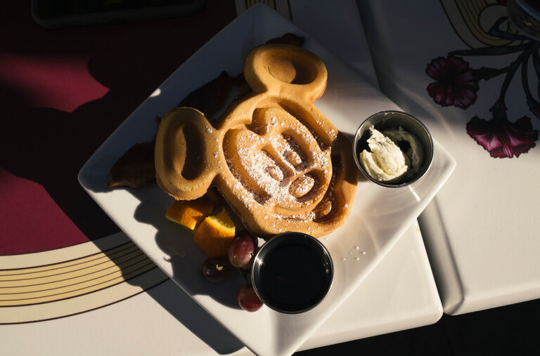 Carnation Cafe, a Victorian-themed restaurant on Main Street, U.S.A., serves popular Mickey-shaped waffles.