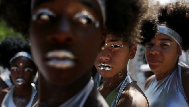 The Visions In Motion dance group prepares to march down Eastern Parkway for the West Indian American Day Parade in celebration of the Caribbean Carnival on September 04, 2017 in the Brooklyn borough of New York City.