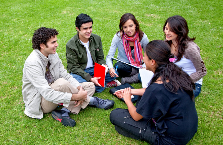 Group of students studying in a circle