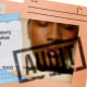 Photo Illustration: A collage of IRS documents and a blurred image of a Black woman, stamped with the word  'AUDIT'