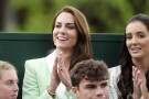 Britain's Kate, Princess of Wales, center, is flanked by former player Laura Robson, right, as they watch the first round women's singles match between Britain's Katie Boulter and Australia's Daria Saville, on day two of the Wimbledon tennis championships in London, Tuesday, July 4, 2023. (Zac Goodwin/Pool Photo via AP)