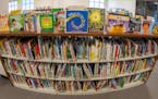 Books sit on shelves in an elementary school library in suburban Atlanta.