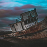A rusty, abandoned ship, listing to one side. Representative of the author’s state of mind at the beginning of the story.