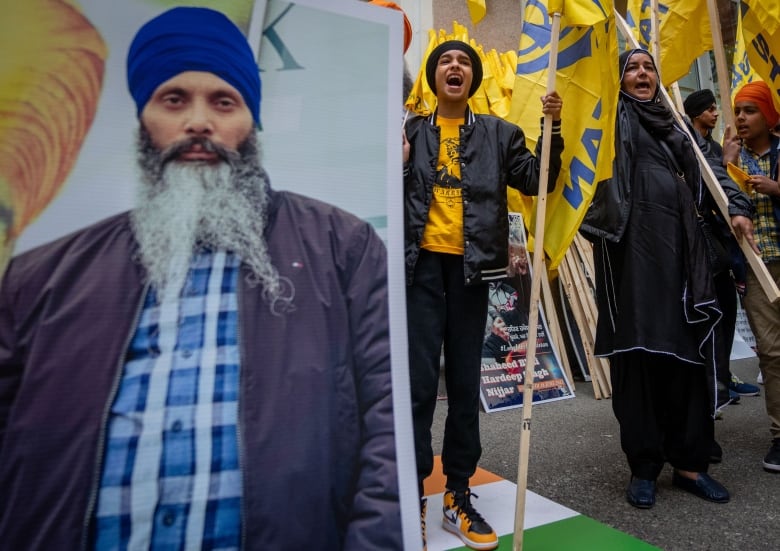 Protesters chant outside of the Consulate General of India office during a protest for the recent shooting of Hardeep Singh Nijjar in Vancouver on Saturday, June 24, 2023.