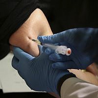 Illustrative: A woman receives a measles, mumps and rubella vaccine at the Rockland County Health Department in Pomona, New York, March 27, 2019.  (Seth Wenig/AP)