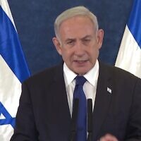 Prime Minister Benjamin Netanyahu delivers a televised address on October 7, 2023. (screen capture/ GPO)