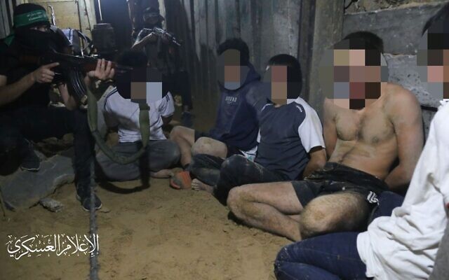 Foreign nationals being held by Hamas gunmen, in an unconfirmed photo distributed on social media.