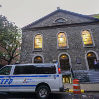 An NYPD patrol car is parked outside a synagogue on the Lower East Side of Manhattan, October 7, 2023. (Mary Altaffer/AP)