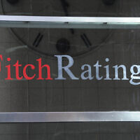 This photo shows signage for Fitch Ratings, in New York, October 9, 2011. (Henny Ray Abrams/AP)