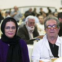 Iranian film director Dariush Mehrjui and his wife Vahideh Mohammadifar attend a film directors' meeting in Tehran, Iran, July 7, 2015. (Abdolvahed Mirzazadeh, ISNA via AP)