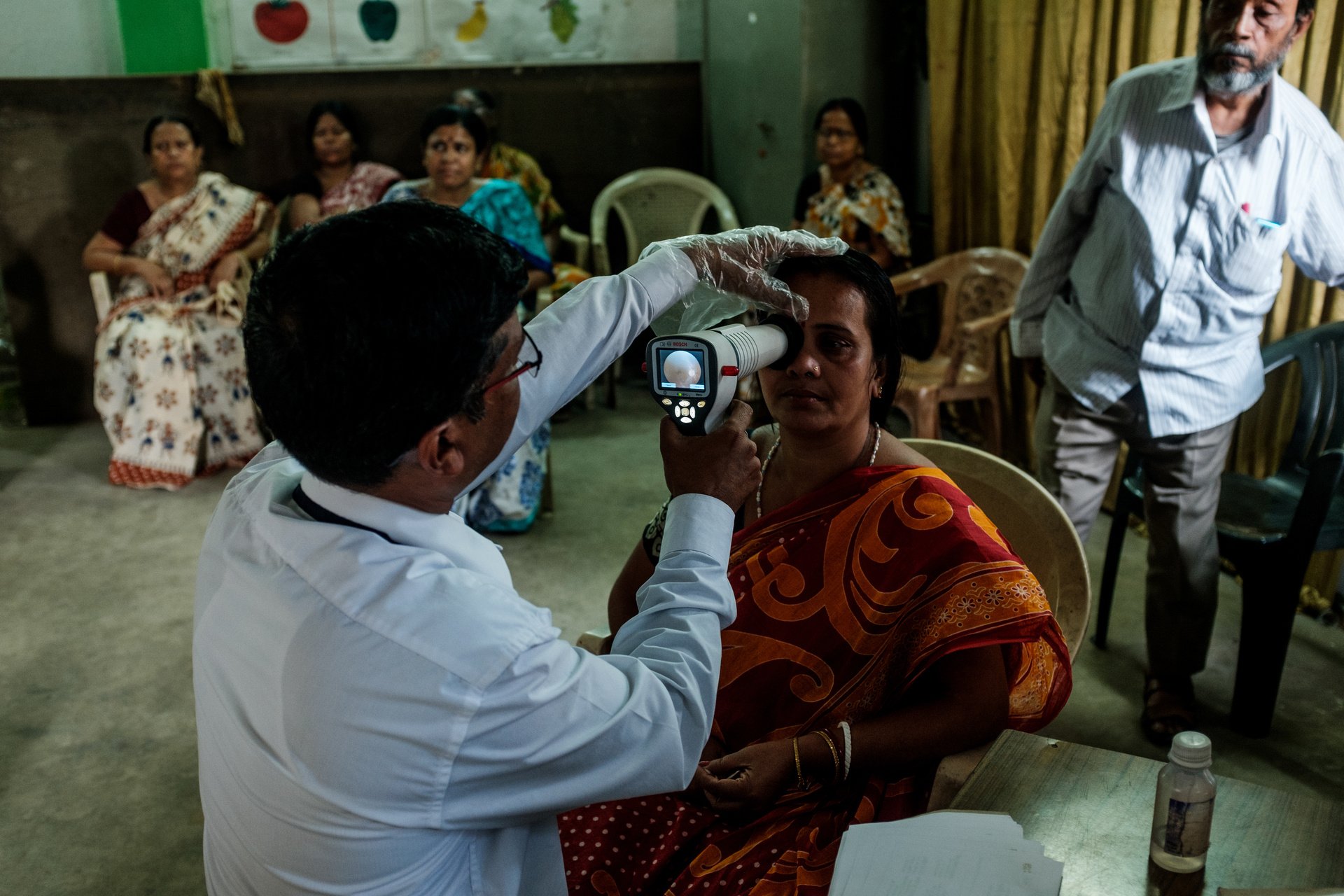 Diabetic Retinopathy (DR) patient is being examined by technician.