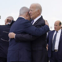 US President Joe Biden is greeted by Prime Minister Benjamin Netanyahu after arriving at Ben Gurion International Airport, October 18, 2023, in Lod. (AP Photo/Evan Vucci)