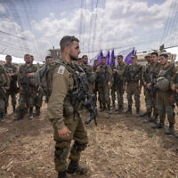 Israeli soldiers at a staging area not far from the Israeli-Gaza border, October 19, 2023. (Chaim Goldberg/Flash90)
