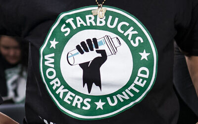 The Starbucks Workers United logo appears on the shirt of a person attending a hearing in Washington on March 29, 2023. (J. Scott Applewhite/AP)