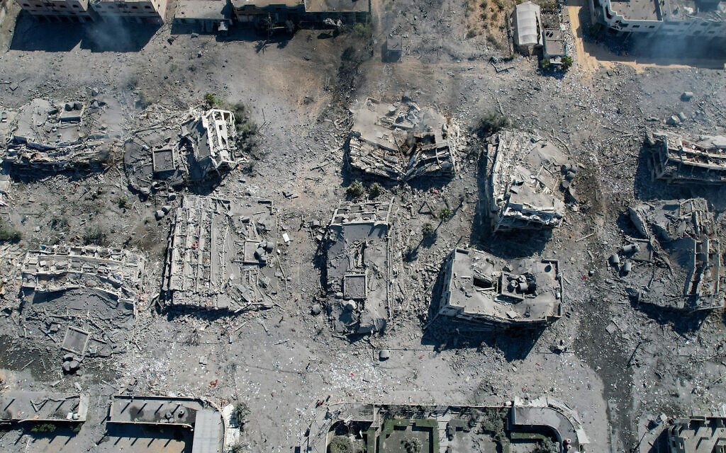 An arial view shows destroyed buildings in al-Zahra city south of Gaza City on October 20, 2023, following overnight Israeli strikes amid the ongoing war between Israel and the Palestinian terror group Hamas. (Belal Alsabbagh/AFP)