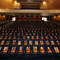 Pictures of over 1,000 persons abducted, missing, or killed in the Hamas onslaught on southern Israel displayed at a temporary exhibition in the Smolarz Auditorium at Tel Aviv University, October 19, 2023. (Chen Galili)